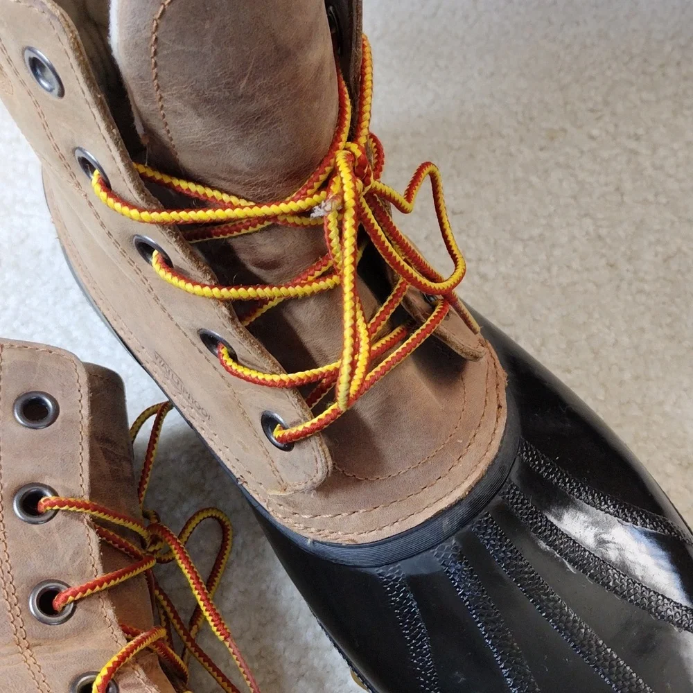 Sorel men's black rubber & tan leather winter boots. Size 11.5